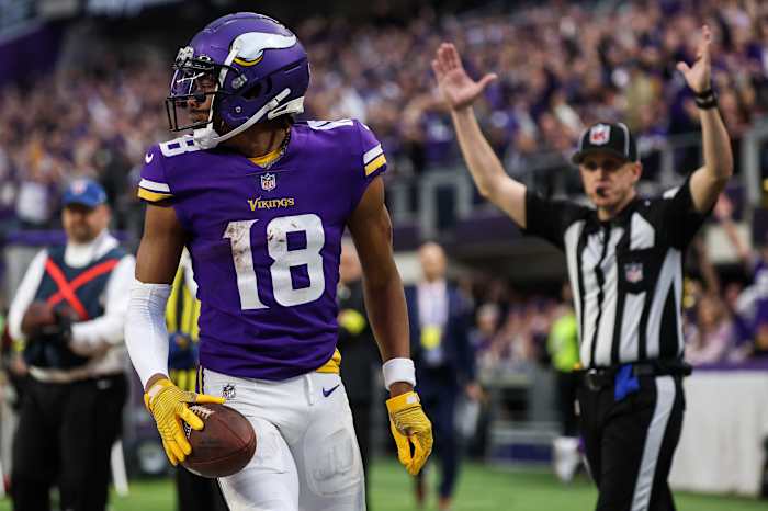 Minnesota, USA; Minnesota Vikings wide receiver Justin Jefferson (18) makes a catch for a touchdown against the Indianapolis Colts during the fourth quarter at U.S. Bank Stadium.